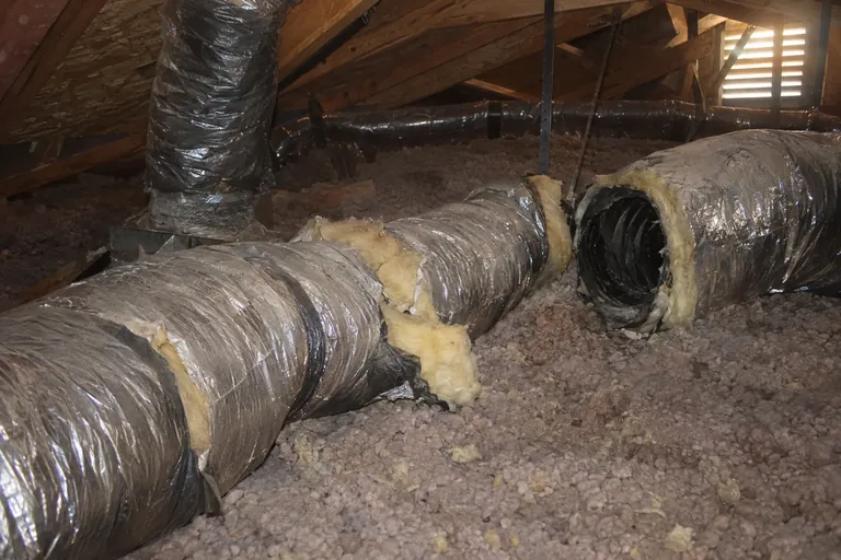 Torn attic ducts before replacement in Glendale, AZ