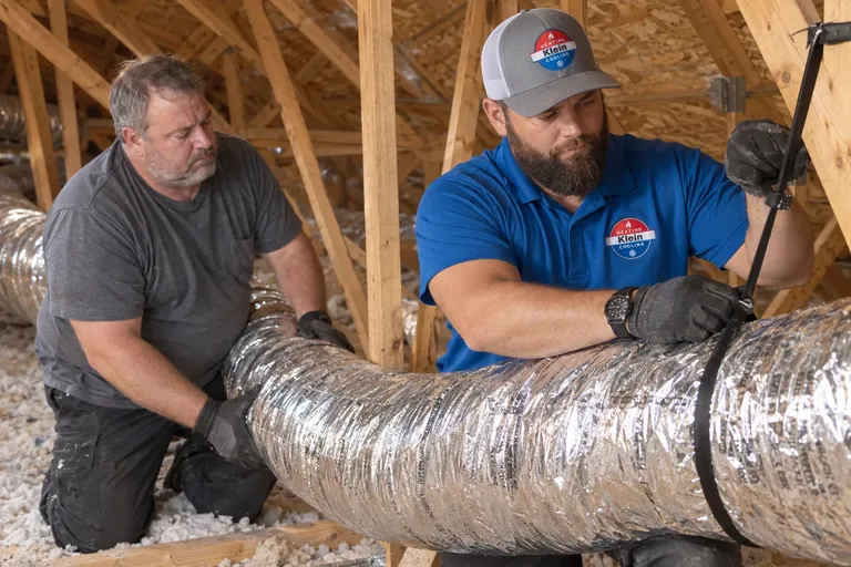 Tomer Klein and a technician replacing attic ductwork in Phoenix, AZ
