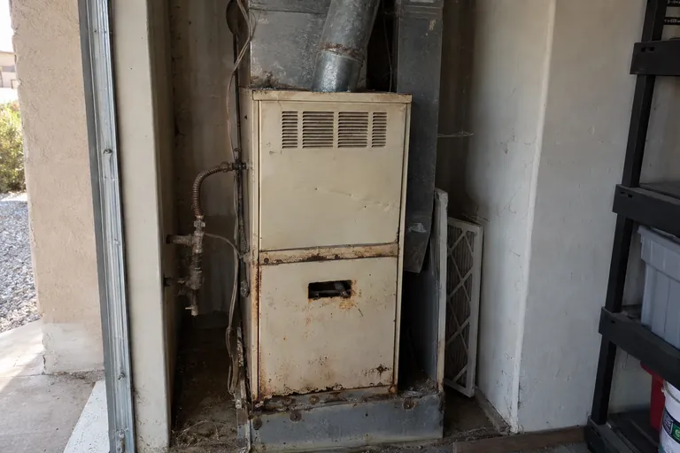 Old gas furnace before replacement in Mesa, AZ